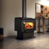 Drolet Escape 2100 Wood Burning Stove installed in a modern living room with warm flames inside
