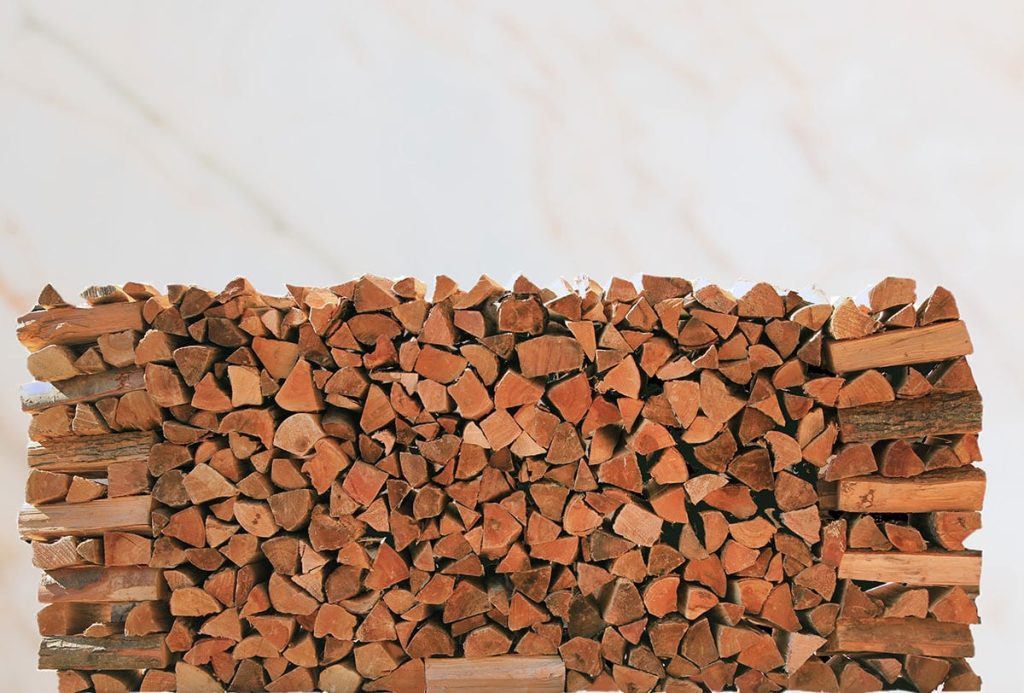 Seasoned cherry firewood neatly stacked and ready for burning in fireplaces and wood stoves